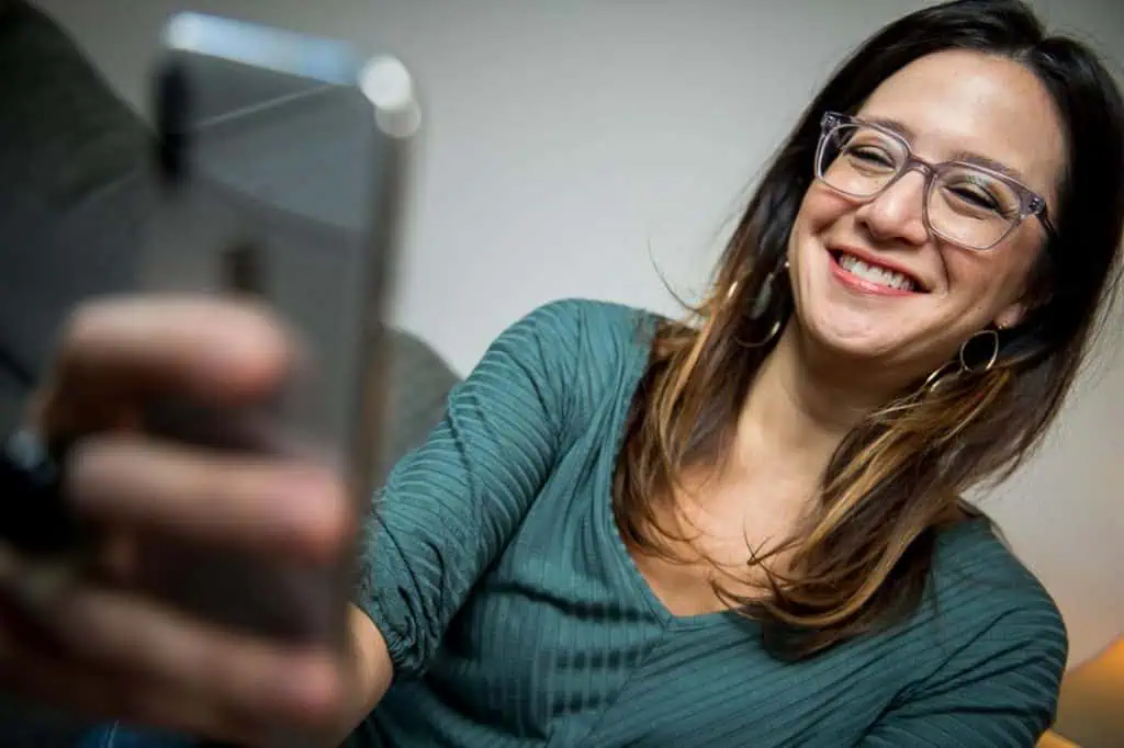 Terri Trespicio laughing at her phone